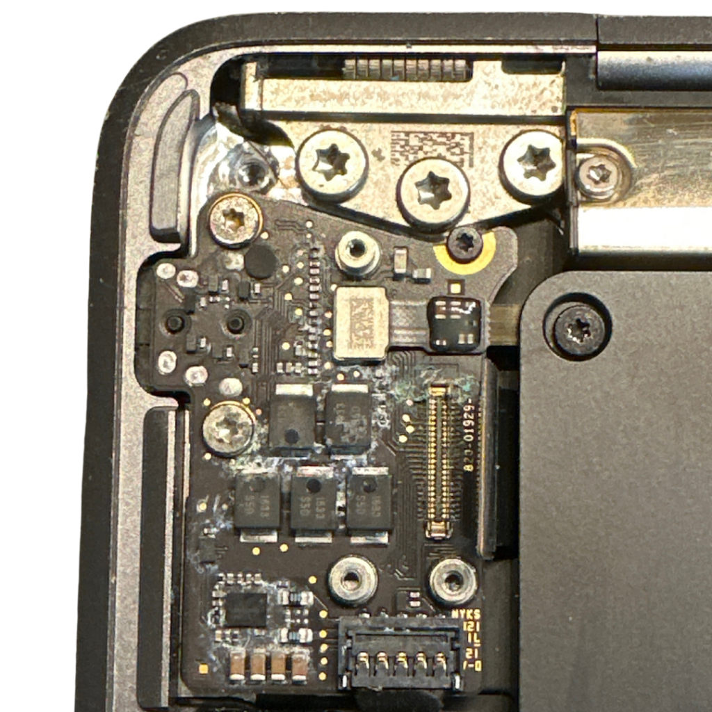 Audio board inside a MacBook Air showing liquid damage